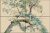 Botanical ceramic tile mural with tree branches and green leaves
